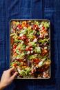 <p>With refried and black beans (and lots of cheese!), you won't miss the meat on these easy nachos.</p><p>Get the <a href="https://www.goodhousekeeping.com/food-recipes/a29960234/how-to-make-nachos-recipe/" rel="nofollow noopener" target="_blank" data-ylk="slk:Double Bean Sheet Pan Nachos recipe;elm:context_link;itc:0;sec:content-canvas" class="link "><strong>Double Bean Sheet Pan Nachos recip</strong><strong>e</strong></a>.</p>