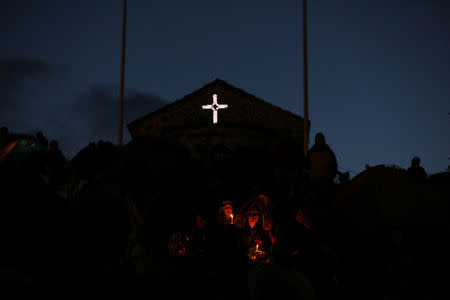 Orthodox Christian pilgrims pray on the eve of the Elevation of the Cross holiday at Krustova Gora (Holly Cross Forest), Bulgaria, September 13, 2018. REUTERS/Stoyan Nenov