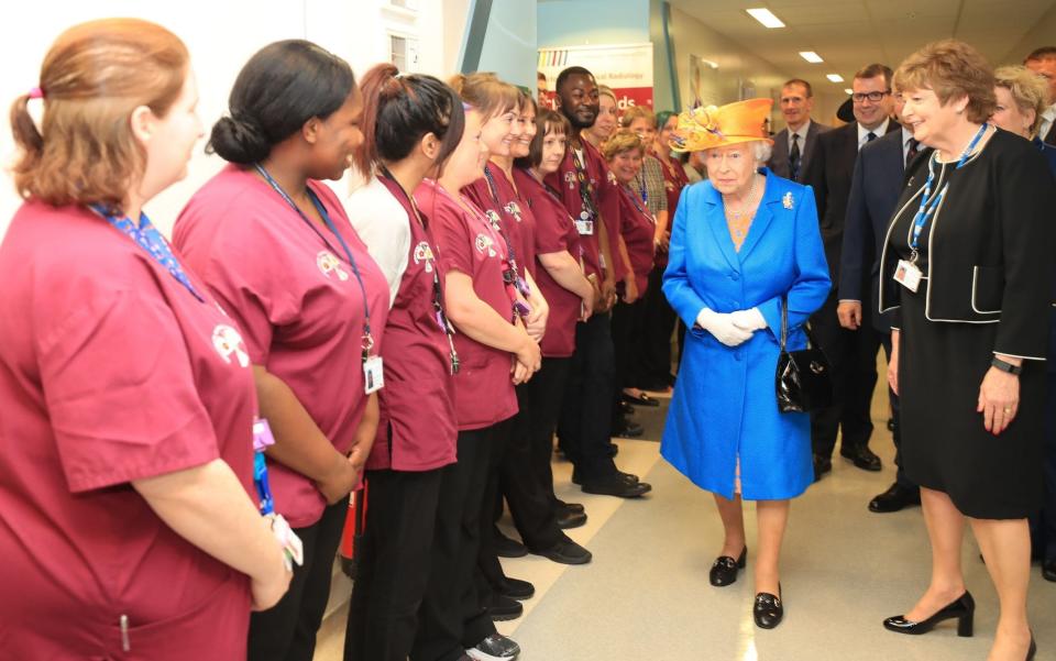 Escorted by Kathy Cowell (right) Chairman of the Central Manchester University Hospital, Queen Elizabeth II visits the Royal Manchester Children's Hospital to meet victims of the terror attack in the city earlier this w - Credit: Peter Byrne/PA