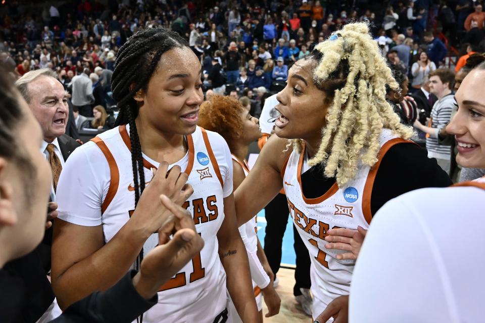 Texas forward Aaliyah Moore, left, celebrates the Sweet 16 win over Ohio State with teammate Lauren Ebo. Moore missed a layup late in the game but also came up with a key block. "I'm glad even as a freshman she could keep her head in it, and that was extremely important," Ebo said.