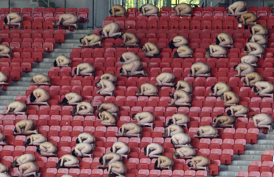 Naked volunteers pose for Tunick, on May 11, 2008 at Vienna's Ernst Happel stadium. Tunick sought to assemble 2008 people in a football stadium three weeks before the opening of the European football championships.