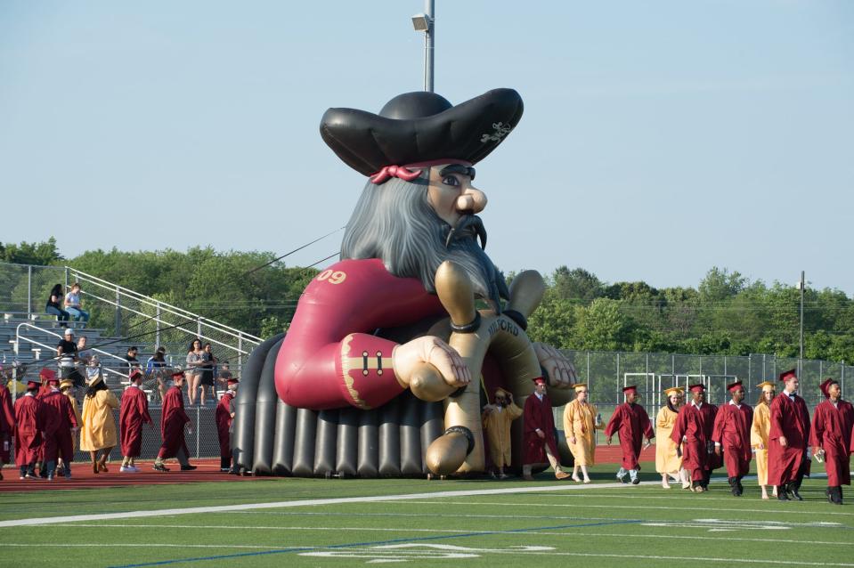 Students process in for the start of the Milford High School graduation ceremony at Bernard E. Briggs Stadium.  231 students graduated.