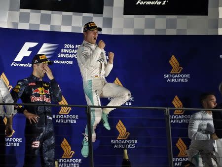 Formula One - F1 - Singapore Grand Prix - Marina Bay, Singapore - 18/9/16. Mercedes' Nico Rosberg of Germany celebrates after winning the race. REUTERS/Edgar Su