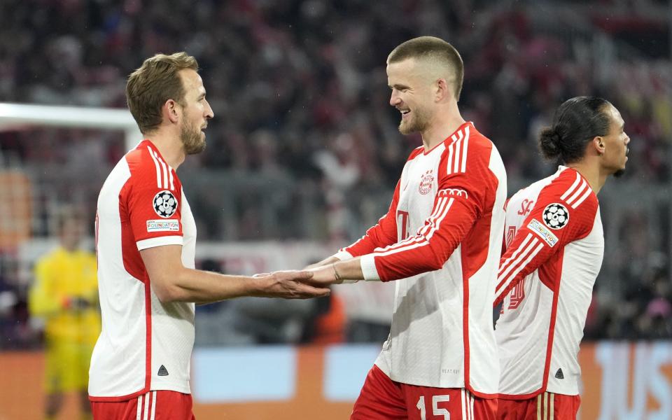 Harry Kane of Bayern Munich celebrates scoring his team's third goal with teammate Eric Dier during the UEFA Champions League