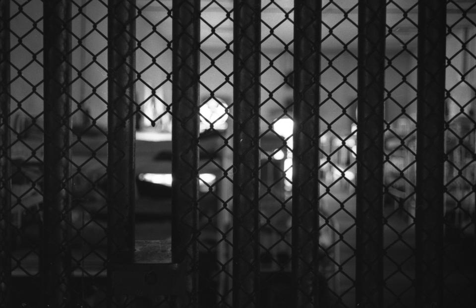 View through prison bars of dormitory bunks at Mississippi State Penitentiary (or Parchman Farm), Mississippi, 1964. Since its opening in 1901, the prison has been notorious for the conditions to which it subjects its inmates.&nbsp; (Photo: Robert Elfstrom/Villon Films via Getty Images)