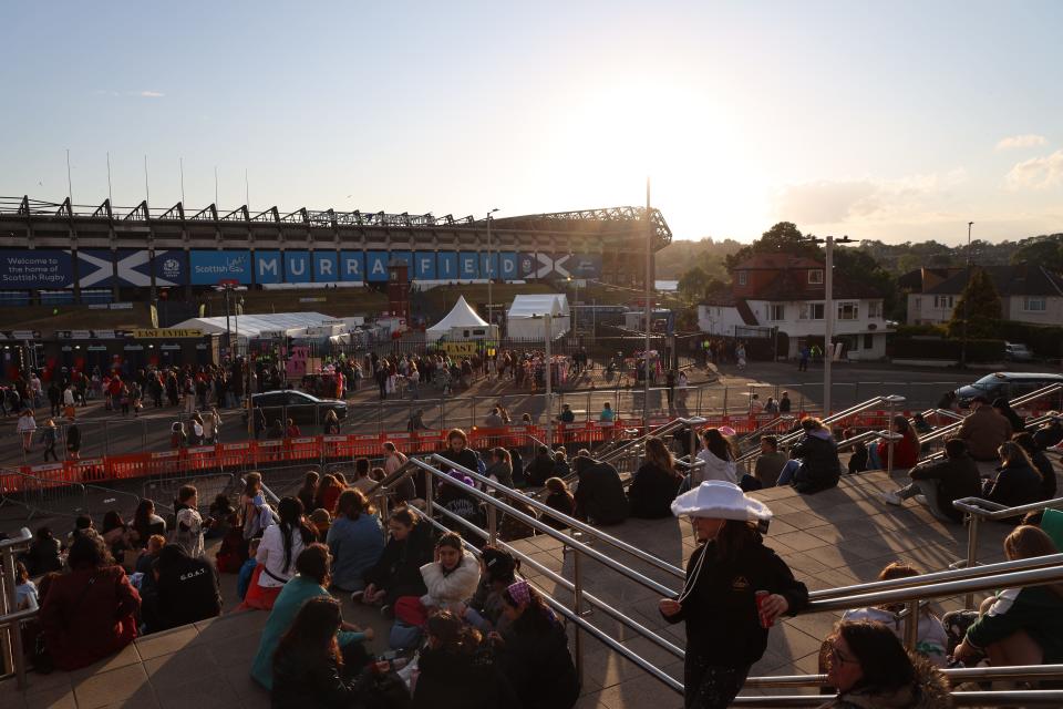 Those outside the stadium began feeling the chill as the sun began to set.