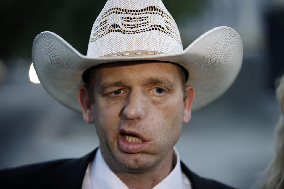 FILE - In this Nov. 14, 2017 file photo, Ryan Bundy leaves federal court in Las Vegas. Brian Cavalier, the former bodyguard for Nevada rancher Bundy's father Cliven Bundy, has become the last person sentenced following the collapse of a federal prosecution stemming from an armed standoff with U.S land management agents nearly five years ago. Chief U.S. District Judge Gloria Navarro sentenced Cavalier on Tuesday, Jan. 15, 2019, to the 20 months he already served in custody for the April 2014 confrontation. (AP Photo/John Locher, File)