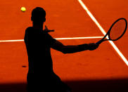 <p>Silhouette of Grigor Dimitrov of Bulgaria in action against P. Kohlschreiber of Germany at the Mutua Madrid Open, Madrid, Spain on May 8, 2017. Dimitirov won 7:6, 6:4. (Rex Shutterstock via ZUMA Press) </p>