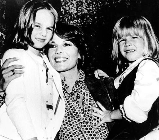 Actress Natalie Wood holds her two children Natasha, left, and Courtney at a studio party in Los Angeles.