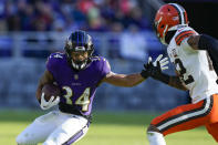 Baltimore Ravens running back Keaton Mitchell looks to run past Cleveland Browns safety Grant Delpit during the first half on an NFL football game Sunday, Nov. 12, 2023, in Baltimore. (AP Photo/Susan Walsh)