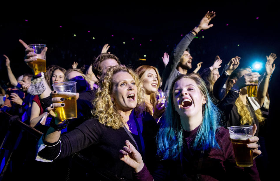 Visitors to the Ziggo Dome attend a performance by Dutch singer Andre Hazes  in Amsterdam on March 7 2021 during a series of trial events in which Fieldlab is investigating how large events can take place safely. (Koen Van Weel / ANP/AFP via Getty Images)