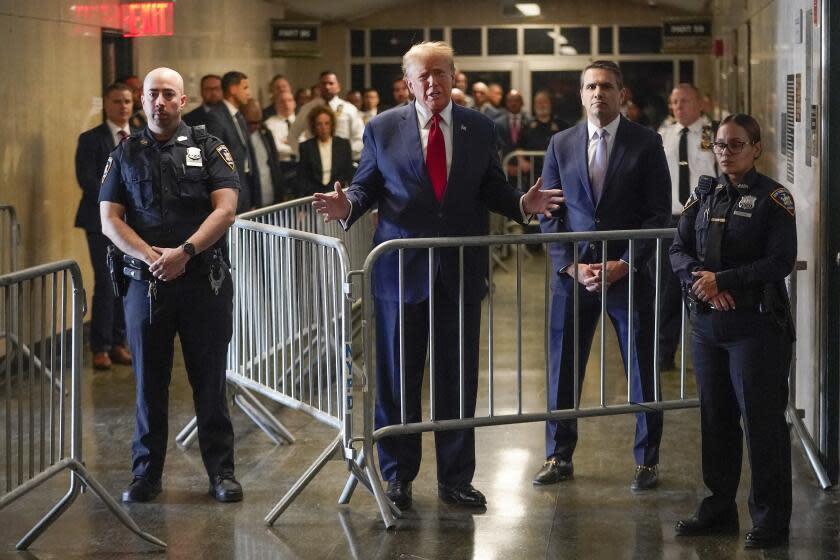 FILE - Former President Donald Trump speaks before entering the courtroom at Manhattan criminal court, Thursday, Feb. 15, 2024, in New York. A dozen Manhattan residents are soon to become the first Americans ever to sit in judgment of a former president charged with a crime. Jury selection is set to start Monday in former President Donald Trump's hush-money trial. (AP Photo/Mary Altaffer, File)