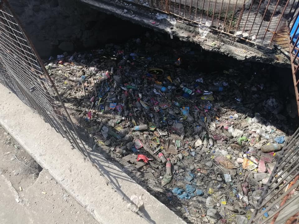 A Philippines canal filled with plastic garbage.