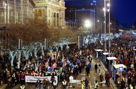 People march during a protest against a proposed new labor law, billed as the "slave law" in Budapest, Hungary, December 16, 2018. REUTERS/Bernadett Szabo