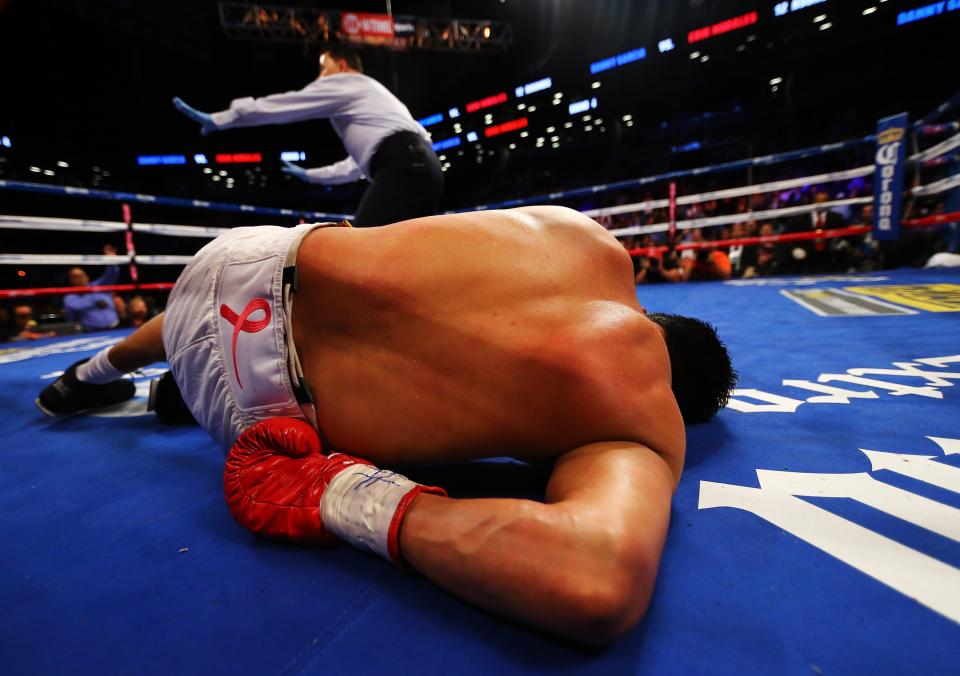 NEW YORK, NY - OCTOBER 20: Erik Morales is knocked out by Danny Garcia in the fourth round during their WBC/WBA junior welterweight title at the Barclays Center on October 20, 2012 in the Brooklyn Borough of New York City. (Photo by Al Bello/Getty Images for Golden Boy Promotions)