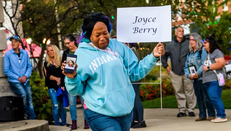 Erika Kraemer fights back emotion as she honors Joyce Berry by placing her name in the Monroe County Courthouse lawn during the Homeless Memorial Vigil on Thursday, Sept. 29, 2022.