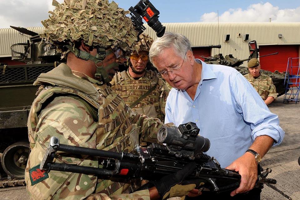 Michael Fallon examining weaponry at Tidworth in 2014 (UK Gov)