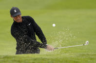 Tiger Woods hits from the bunker on the 17th hole during a practice round for the PGA Championship golf tournament at TPC Harding Park Wednesday, Aug. 5, 2020, in San Francisco. (AP Photo/Charlie Riedel)