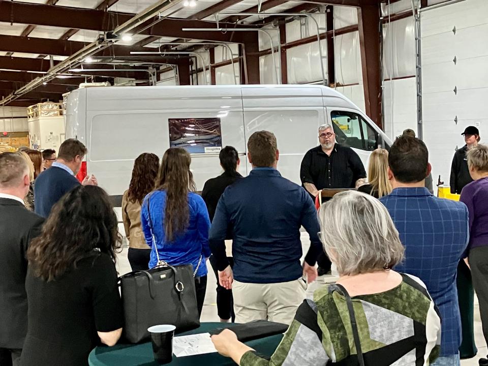 A high-tech logistics firm has established its Midwest regional hub in Green Oak Township. Kelly Weaver, the company's director of operations for Michigan, is shown at a ribbon cutting.