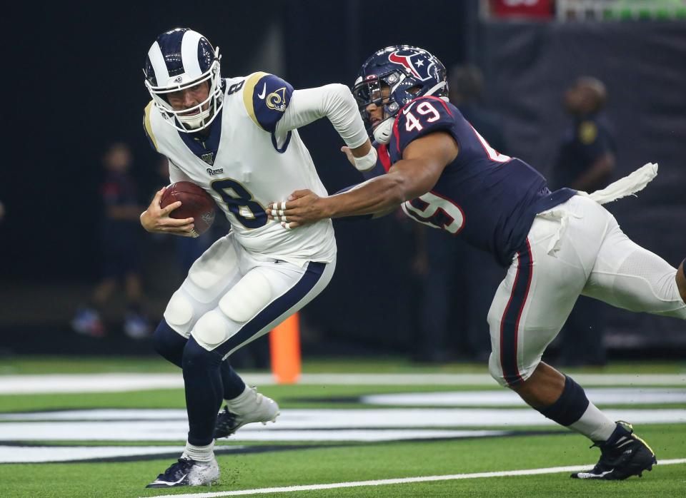 Texans linebacker Jamal Davis II closes in on Los Angeles Rams quarterback Brandon Allen in a preseason game, Aug. 29, 2019, in Houston.