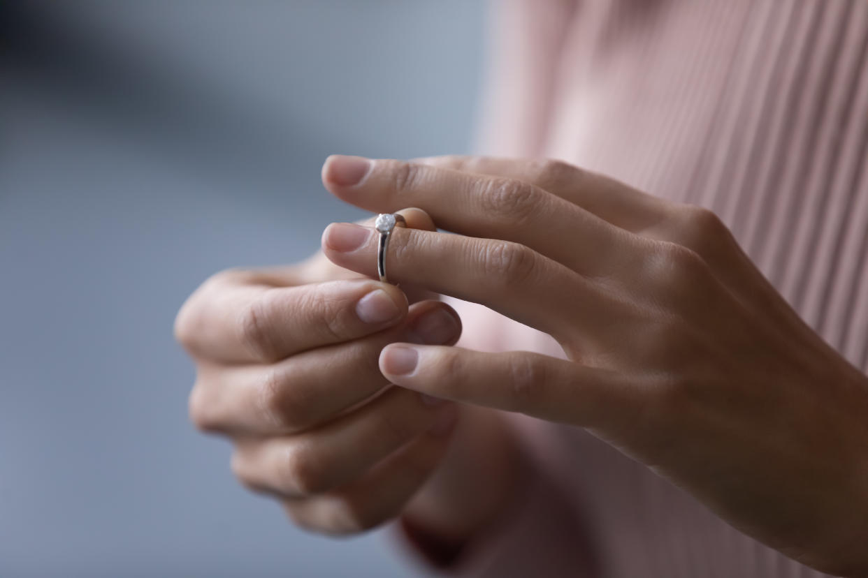 amazon ring sizer Unrecognizable young woman takes off wedding ring, remove engagement jewellery as sign of divorcement, close up cropped view. Break up, cheated wife, infidelity, marriage end, relations split concept