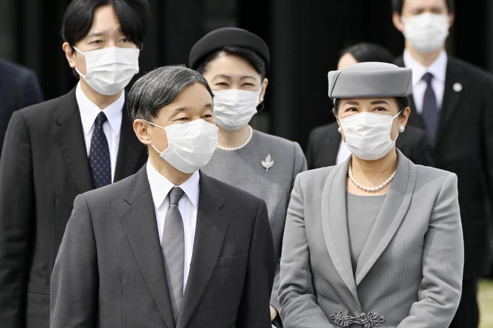 Japanese Emperor Naruhito and Empress Masako prepare to leave for Britain, at Haneda airport in Tokyo Saturday, Sept. 17, 2022. They will attend Queen Elizabeth II’s state funeral to pay respects to her. Crown Prince Akishino and Crown Princess Kiko are seen behind. (Kyodo News via AP)