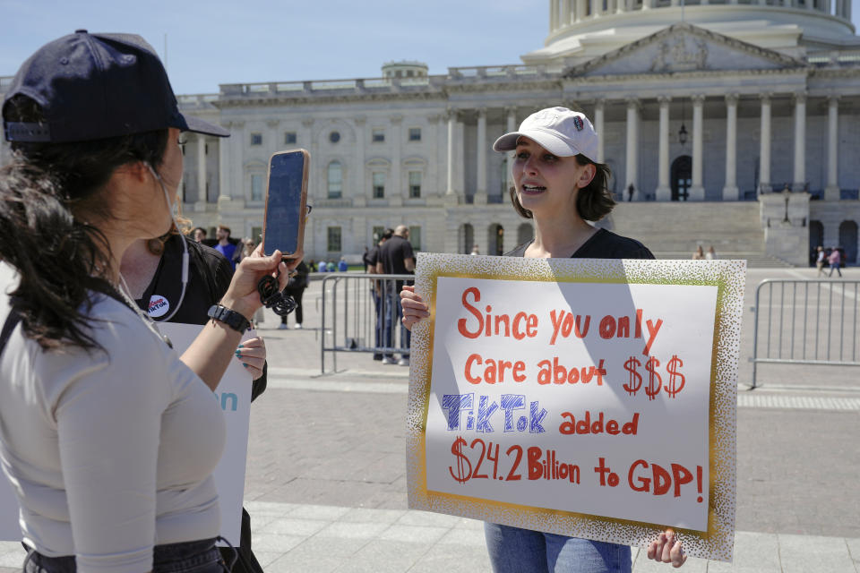 A TikTok content creator speaks to reporters outside the U.S. Capitol on Tuesday, April 23, 2024, in Washington.  (AP Photo/Mariam Zuhaib)