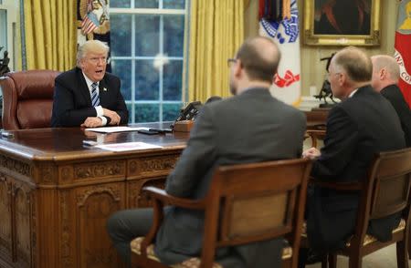 U.S. President Donald Trump (L) speaks during an interview with Reuters in the Oval Office of the White House in Washington, U.S., April 27, 2017. REUTERS/Carlos Barria