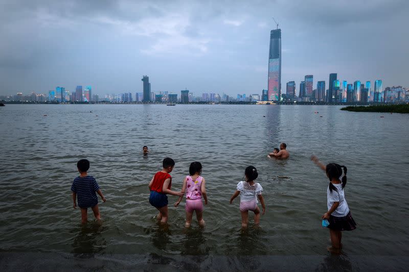 People take a dip on a summer day in the Yangtze River in Wuhan