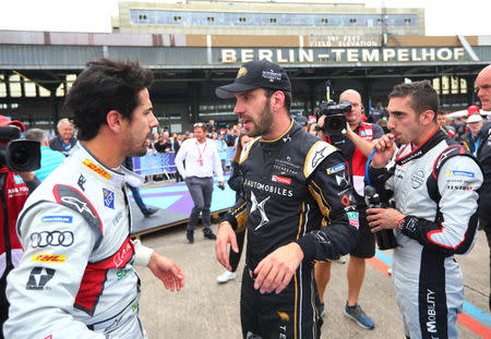 Motorsport - Formula E - Berlin ePrix - Berlin-Tempelhof, Berlin, Germany - May 25, 2019 Audi Sport Abt Schaeffler's Lucas Di Grassi (L) celebrates winning the race alongside third placed Techeetah's Jean-Eric Vergne (C) and second placed Nissan E.Dams' Sebastien Buemi (R) REUTERS/Hannibal Hanschke