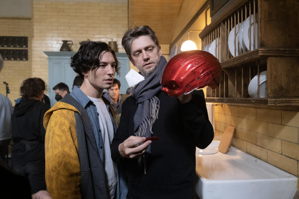 EZRA MILLER and director ANDY MUSCHIETTI and on the set of The Flash. (Warner Bros.)
