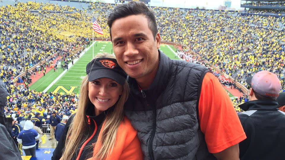 Here's Christian and Aaron on their first date, watching their alma mater Oregon State play football. - Christian Maluo and Aaron Maluo