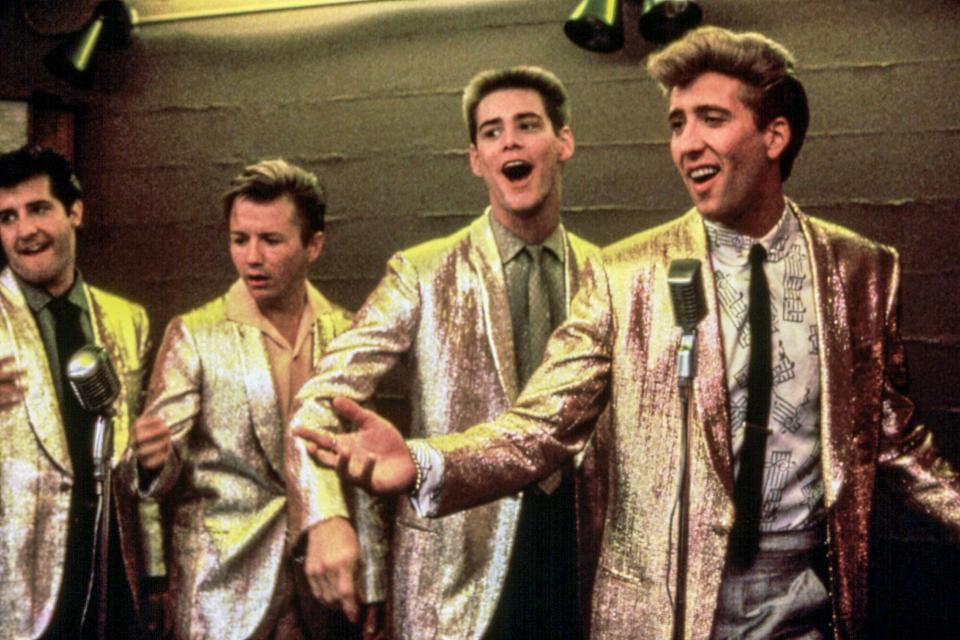 PEGGY SUE GOT MARRIED (1986) Jim Carrey (2nd from right) and Nicolas Cage (R)