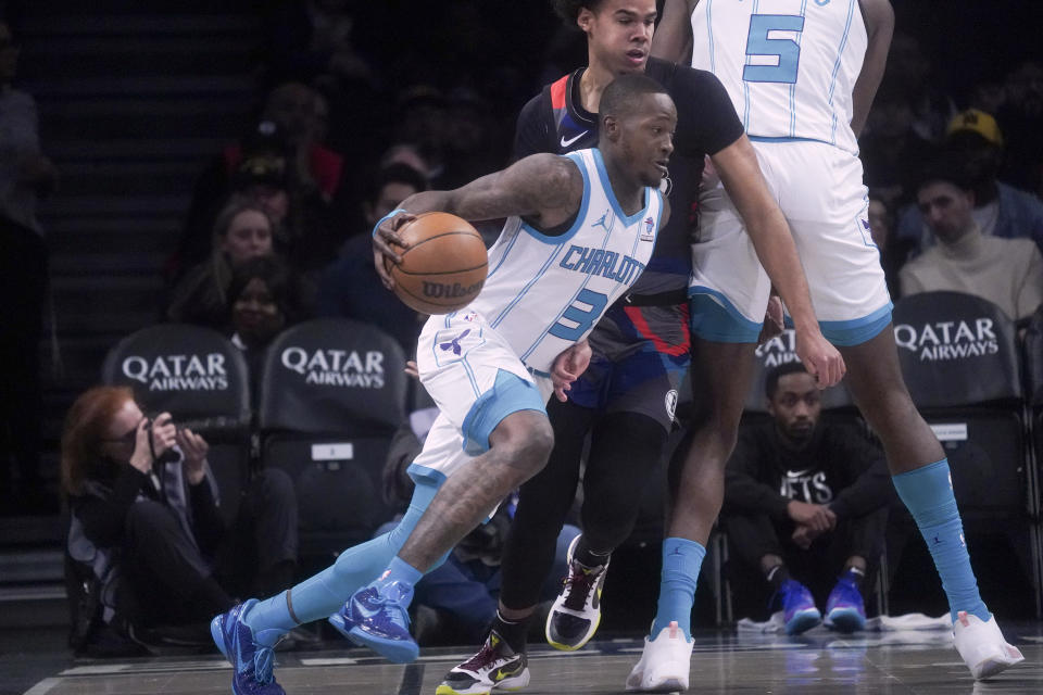 Charlotte Hornets' Terry Rozier dribbles to the basket during an NBA basketball game against the Brooklyn Nets, Thursday, Nov. 30, 2023, in New York. (AP Photo/Bebeto Matthews)