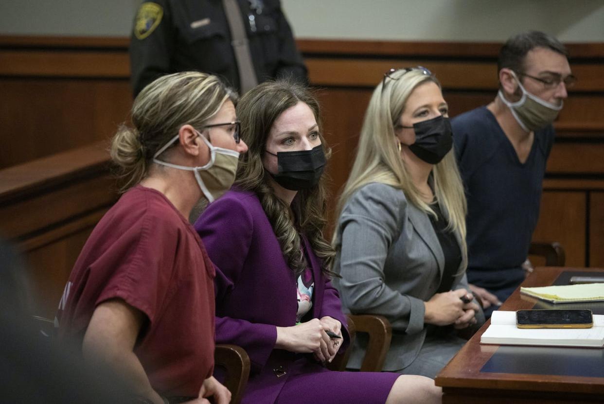 <span class="caption">Jennifer Crumbley, at left, and her husband, James, at far right, sit with their attorneys during a hearing.</span> <span class="attribution"><a class="link " href="https://www.gettyimages.com/detail/news-photo/james-crumbley-and-jennifer-crumbley-sit-with-their-news-photo/1237230565?adppopup=true" rel="nofollow noopener" target="_blank" data-ylk="slk:Bill Pugliano/Getty Images;elm:context_link;itc:0;sec:content-canvas">Bill Pugliano/Getty Images</a></span>