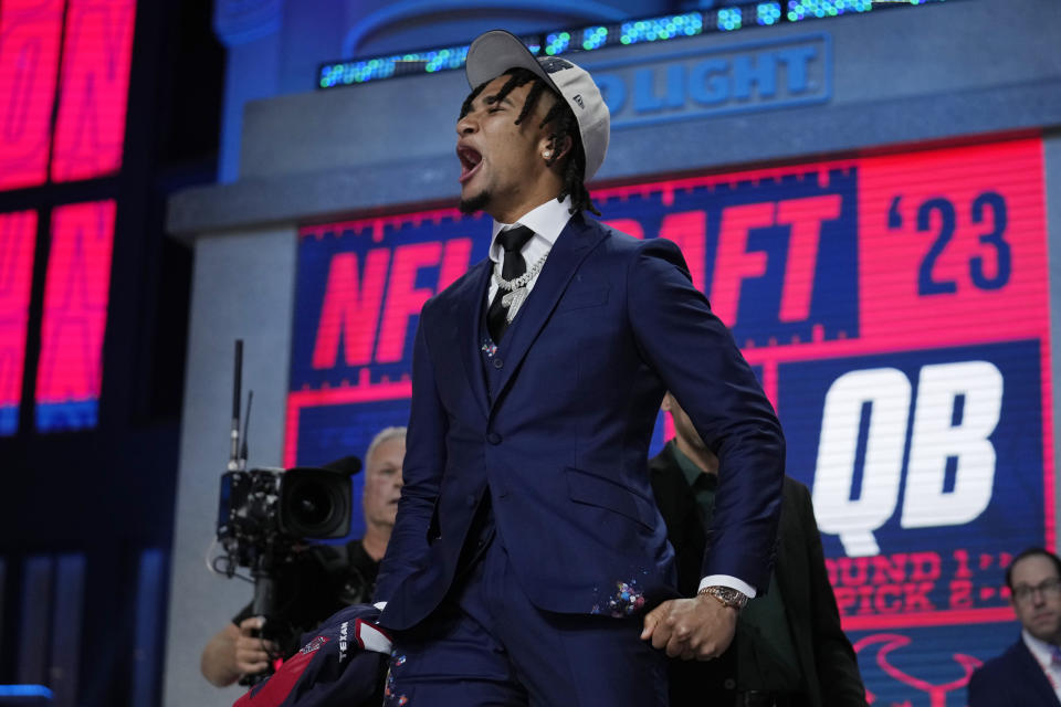 Ohio State quarterback C.J. Stroud reacts after being chosen by the Houston Texans with the second overall pick during the first round of the NFL football draft, Thursday, April 27, 2023, in Kansas City, Mo. (AP Photo/Jeff Roberson)