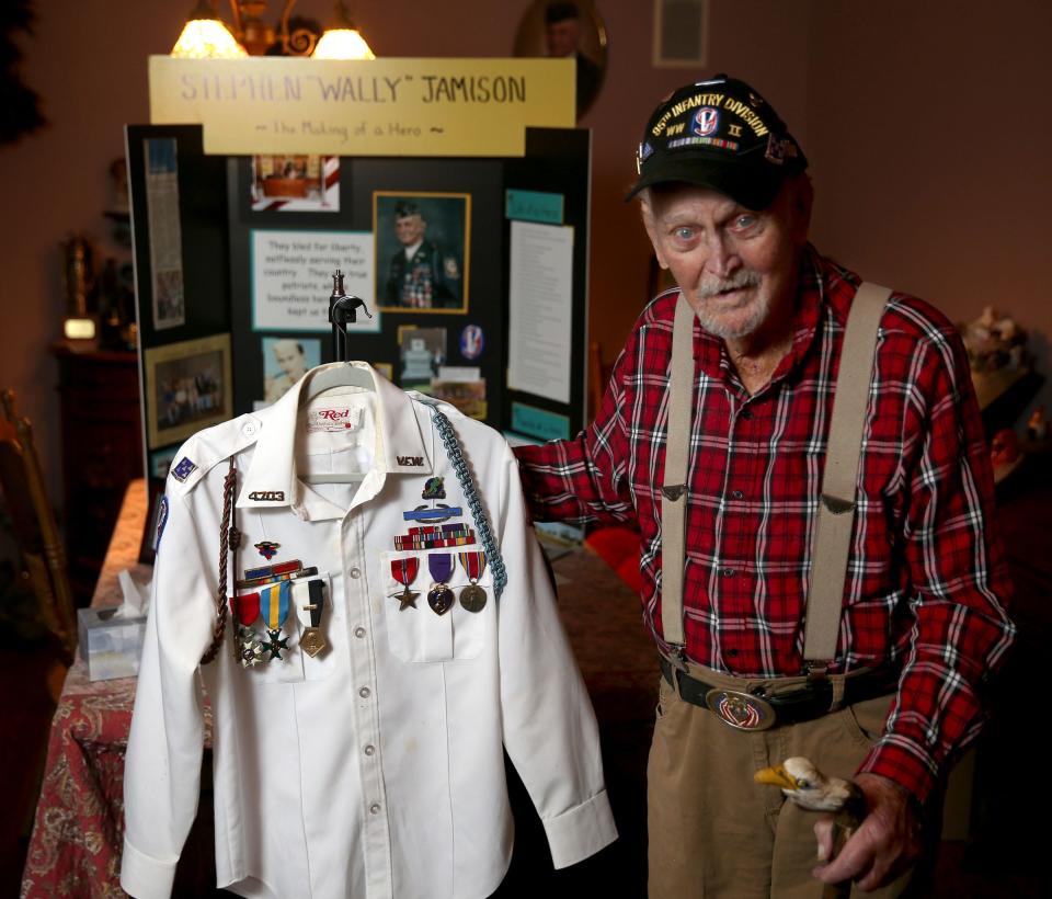 World War II veteran Stephen "Wally" Jamison, who is turning 100 Saturday, is shown with medal enshrined shirt at his Jackson home Wednesday, February 15, 2023.  His hometown is throwing a parade to honor Jamison on Saturday.