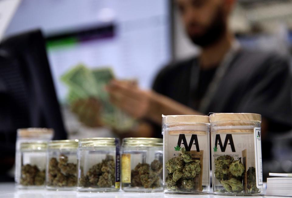 A cashier rings up a marijuana sale at a cannabis dispensary in Las Vegas on July 1, 2017.