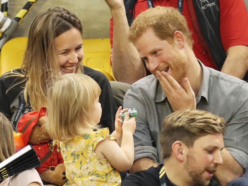 <p>During another appearance watching the games, Harry joked around with a little girl <a rel="nofollow noopener" href="https://www.harpersbazaar.com/uk/culture/culture-news/a44034/prince-harry-toddler-popcorn-invictus-games-meghan-markle/" target="_blank" data-ylk="slk:who was caught stealing his popcorn;elm:context_link;itc:0;sec:content-canvas" class="link ">who was caught stealing his popcorn</a>.</p>