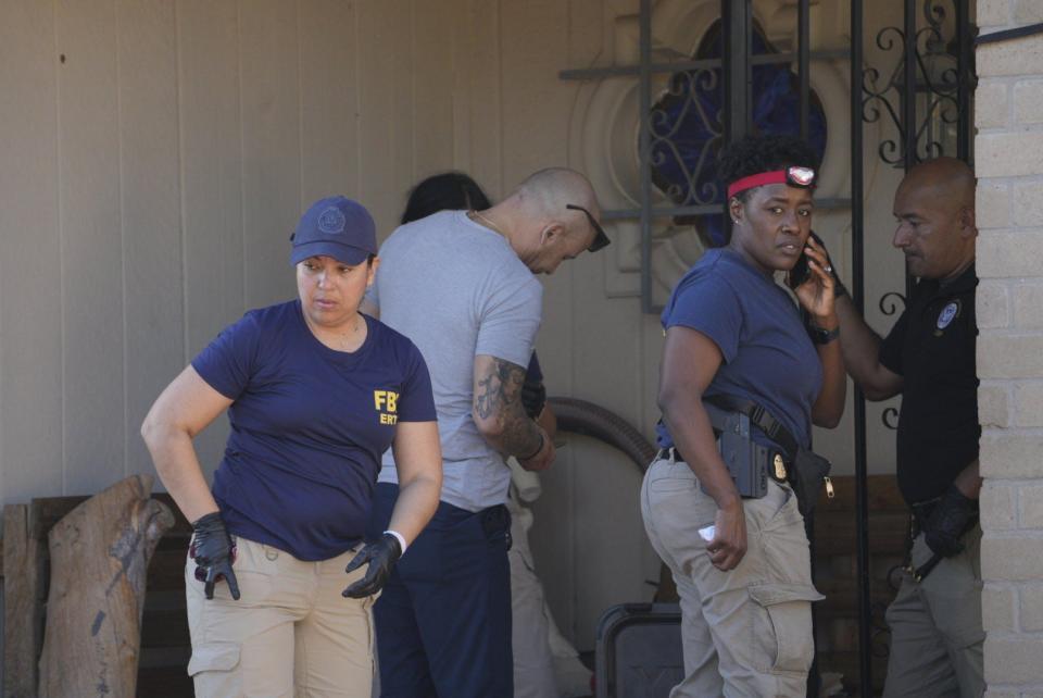 FBI agents and other law enforcement officers search a West El Paso home on Thursday, Aug. 29, 2024, as part of raids targeting Chuco Tango gang members.