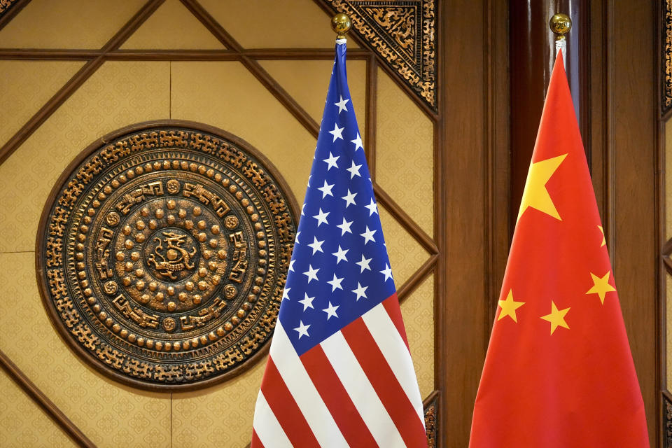 Flags of the U.S and China sit in a room where U.S. Secretary of State Antony Blinken meets with China's Minister of Public Security Wang Xiaohong at the Diaoyutai State Guesthouse, Friday, April 26, 2024, in Beijing, China. (AP Photo/Mark Schiefelbein, Pool)