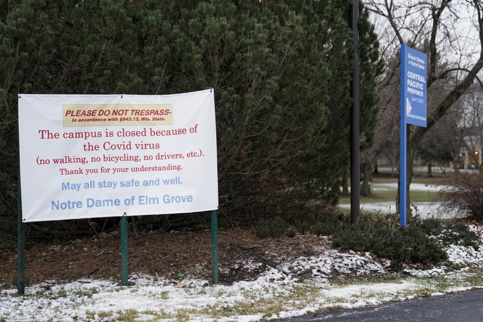 A do not trespass sign is displayed outside the School Sisters of Notre Dame Central Pacific Province, Thursday, Dec. 17, 2020, in Elm Grove, Wis. Eight nuns living in the suburban Milwaukee covent have died in the last week from COVID-19, according to the congregation. (AP Photo/Morry Gash)