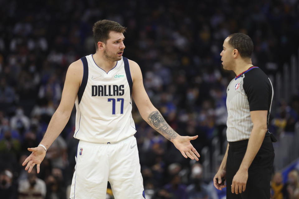 Dallas Mavericks guard Luka Doncic (77) argues with referee Jonathan Sterling during the first half of an NBA basketball game against the Golden State Warriors in San Francisco, Tuesday, Jan. 25, 2022. (AP Photo/Jed Jacobsohn)