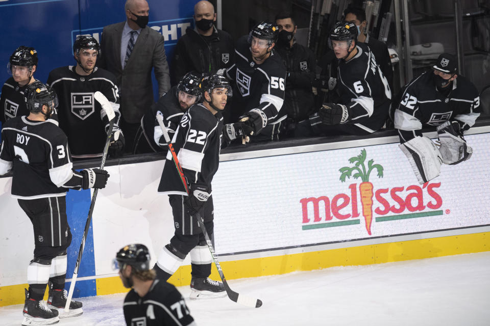 Los Angeles Kings left wing Andreas Athanasiou (22) is congratulated for his goal during the third period of the team's NHL hockey game against the Colorado Avalanche on Tuesday, Jan. 19, 2021, in Los Angeles. (AP Photo/Kyusung Gong)