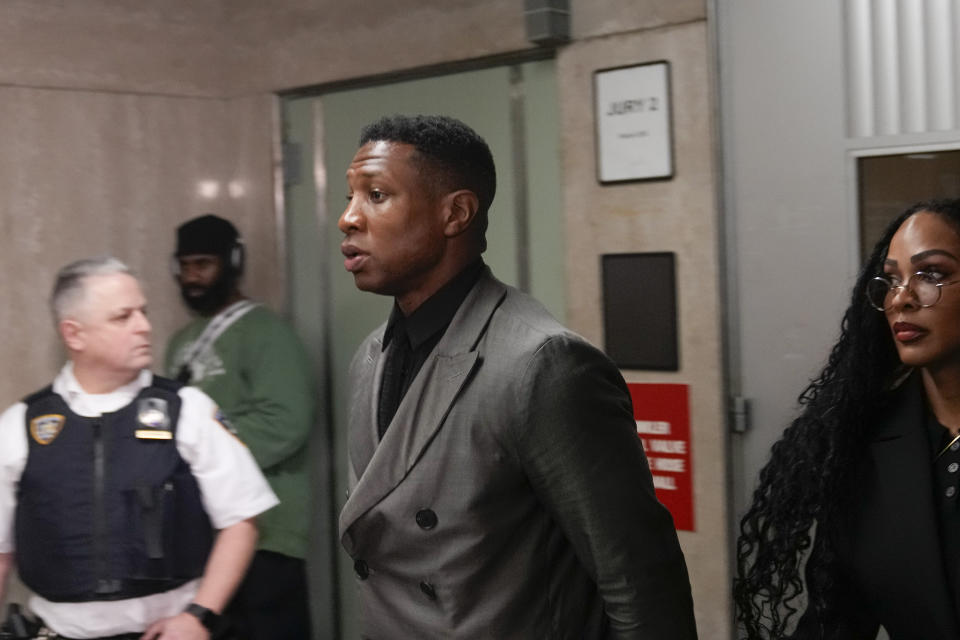 Jonathan Majors leaves a courtroom at the Manhattan criminal courts in New York, Monday, Dec. 18, 2023. The actor is accused of assaulting his then-girlfriend as the two struggled over a phone in the back seat of a chauffeured car. (AP Photo/Seth Wenig)
