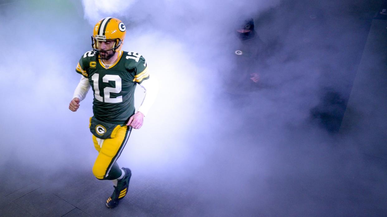 Mandatory Credit: Photo by MARK BLACK/UPI/Shutterstock (11713147ah)Green Bay Packers quarterback Aaron Rodgers (12) runs out of the tunnel for the Divisional Playoff game against the Los Angeles Rams at Lambeau Field in Green Bay, Wisconsin, on Saturday, January 16, 2021.