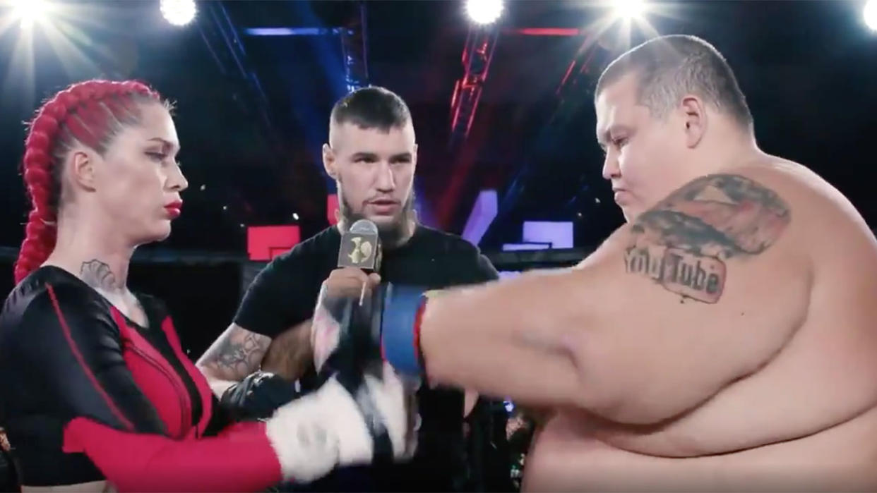 Seen here, Female MMA star Darina Mazdyuk and 240kg Youtuber Grigory Chistyakov touch gloves before their fight.