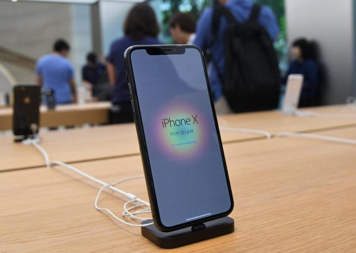 Apple is strengthening encryption to thwart unauthorized access to its iPhone either from hackers or law enforcements (AFP Photo/ROSLAN RAHMAN)