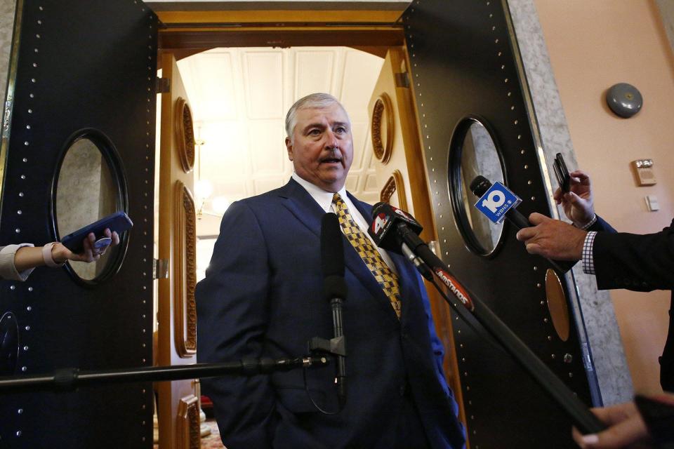Ex-Ohio House Speaker Larry Householder talks to the press outside of the House of Representatives in the Statehouse after returning for the first time since being charged in a $60 million bribery scandal.