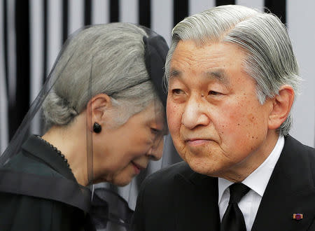 FILE PHOTO: Japan's Emperor Akihito (R) and Empress Michiko leave after praying at the altar of late Prince Tomohito, a cousin of the Emperor, in Tokyo June 19, 2012. REUTERS/Itsuo Inouye/Pool/File Photo